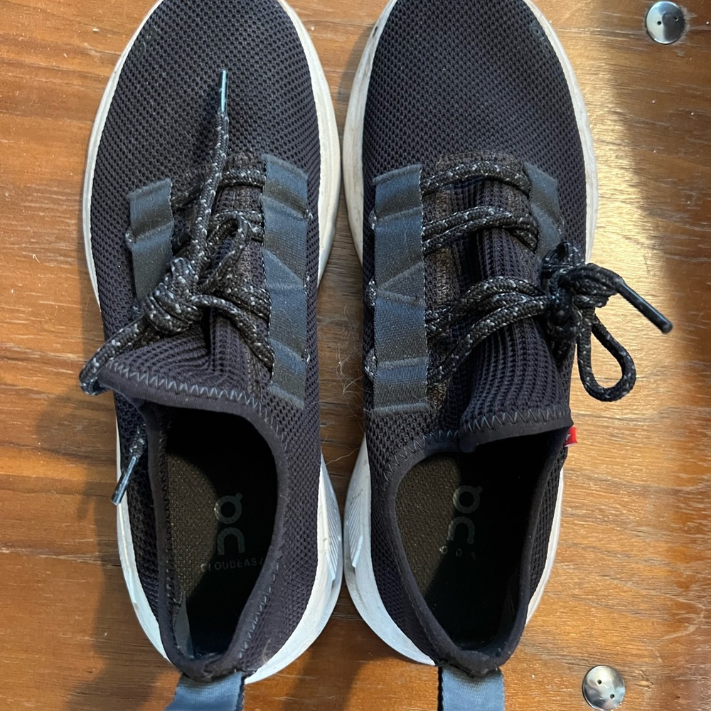 On Running Black and White Athletic Shoes with Sleek Design